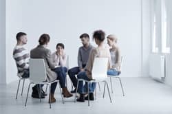 small group sits in circle talking